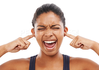 Buy stock photo Face, shouting and fingers in ears with a woman in studio isolated on a white background to block sound. Frustrated, screaming and eyes closed with an angry young person closeup to stop loud noise