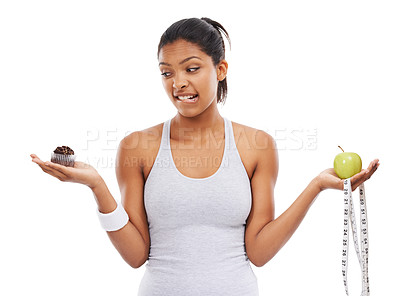 Buy stock photo Woman, apple and cupcake decision for diet in studio for weight loss choice, healthy eating or white background. Female person, fruit and dessert thinking for nutrition food, balance or mockup space