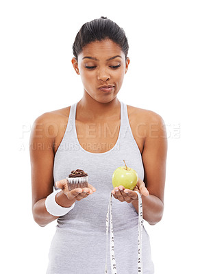 Buy stock photo Woman, dessert and apple thinking in studio for diet weightloss choice, healthy eating or white background. Female person, fruits and cupcake decision for nutrition food, wellness or mockup space