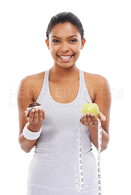 Buy stock photo Portrait, fitness or woman with an apple or cupcake as a sports person in studio isolated on a white background. Exercise, smile and the choice of fruit or chocolate with a confident young athlete