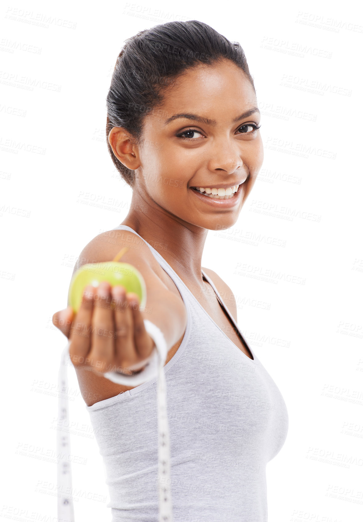 Buy stock photo Happy woman, portrait and lose weight with a measuring tape and apple in white background or studio. Indian, model and healthy food for results in fitness, wellness and diet with nutrition and fruit