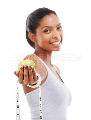 Buy stock photo Apple, tape measure and lose weight with happy woman in white background or studio. Indian, model and portrait with healthy food for results in fitness, wellness and diet with nutrition and fruit