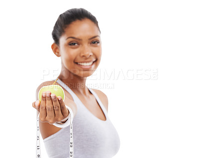 Buy stock photo Happy, woman and lose weight with apple and tape measure in white background, studio or mockup. Model, portrait and healthy food for results in fitness, wellness or diet with fruit or nutrition