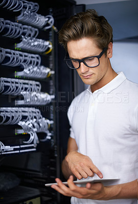 Buy stock photo Server room, information technology and man for typing, tablet or check connectivity at night job. Cybersecurity system, it network or person for internet cable, data center or storage with thinking