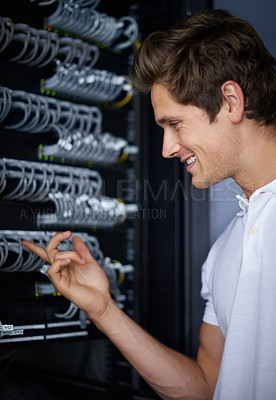 Buy stock photo Server room, man and check cables with smile, thinking and connectivity with hardware in night. Cybersecurity system, it network and technician for glitch, data center and problem solving for error