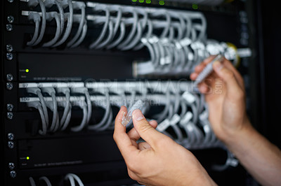 Buy stock photo A computer technician connecting cables