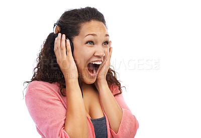 Buy stock photo Woman, wow face and excited for music, headphones and studio background. Happy, crazy and surprise girl listening to audio, podcast and radio of amazing entertainment announcement on white background