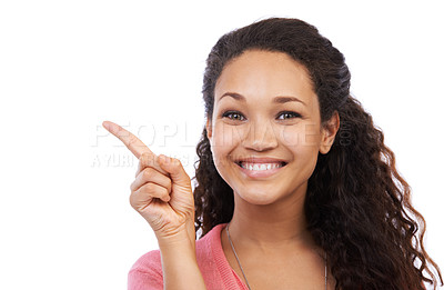Buy stock photo Young black girl, smile portrait and point finger for advertising mockup, marketing and branding in white background. Person, happy face and gesture, happiness and product placement space in studio