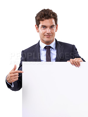 Buy stock photo Pointing, poster and portrait of businessman in studio with mockup space for marketing, promotion or advertising. Smile, happy and person from Canada with empty poster isolated by white background.