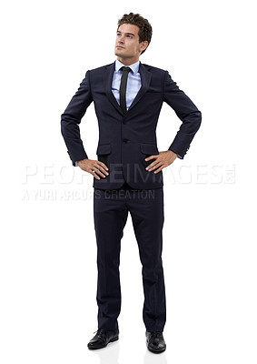 Buy stock photo Thoughtful young businessman with his hands on his hips against a white background