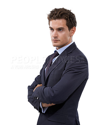 Buy stock photo Handsome young businessman with his arms folded against a white background