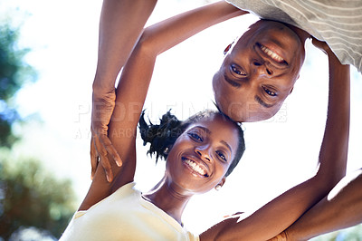 Buy stock photo Happy, nature and bottom portrait of black couple on a valentines day date in a garden or park. Smile, love and young African man and woman bonding on adventure in outdoor field from below together.