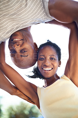 Buy stock photo Smile, nature and bottom portrait of black couple on a valentines day date in a garden or park. Happy, love and young African man and woman bonding on adventure in outdoor field from below together.