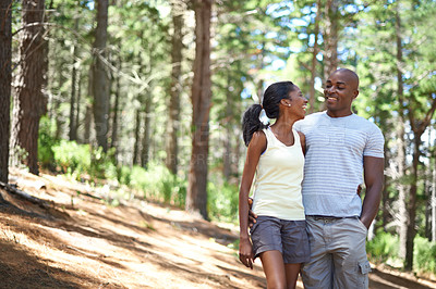 Buy stock photo Happy couple, smile and hiking path for adventure in forest park for partnership relax, summer exercise or sunshine love. Black people, outdoor workout and trees walking for health, date or marriage