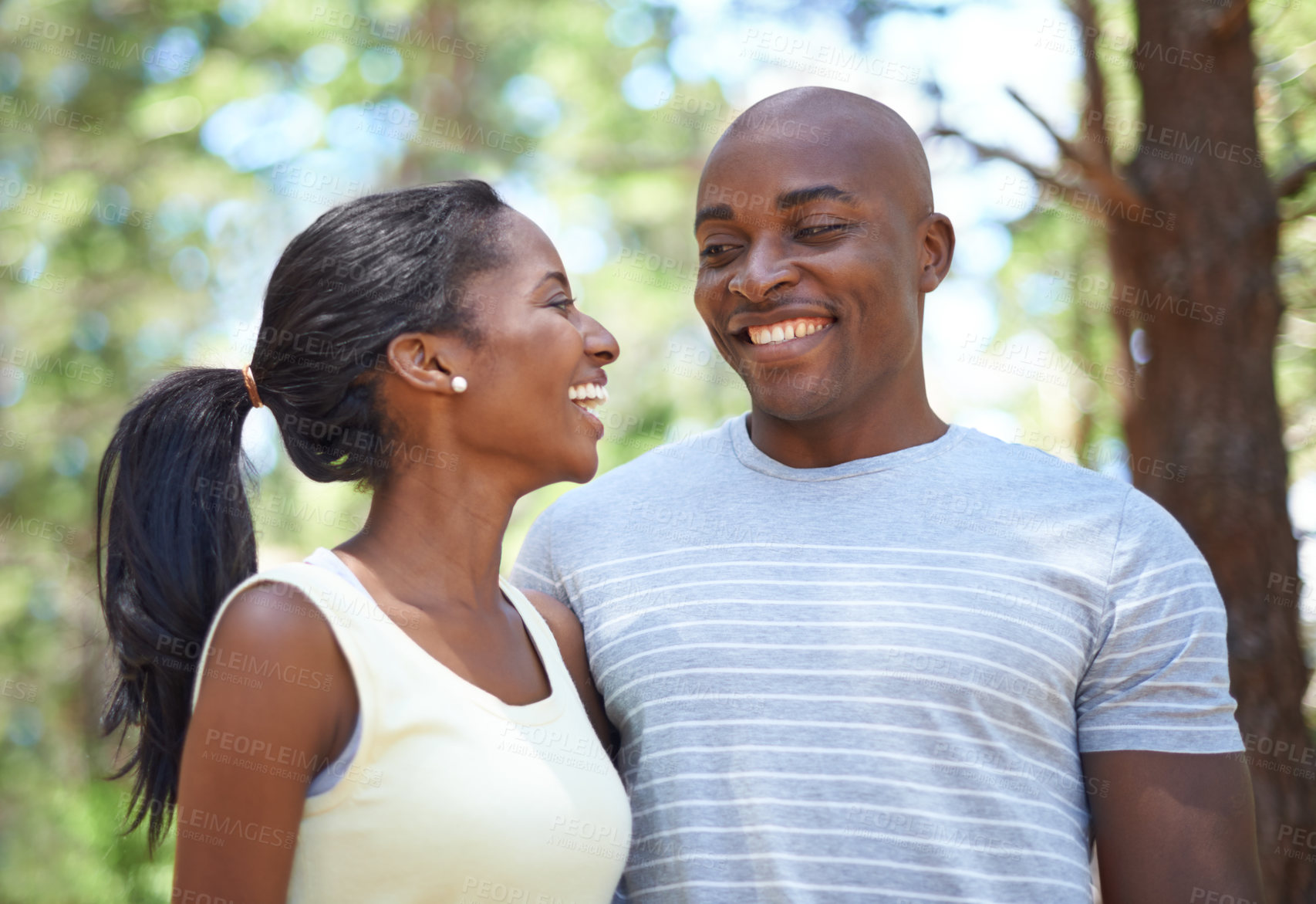 Buy stock photo Happy couple, smile and hiking nature for adventure on forest path or partnership relax, summer exercise or sunshine love. Black people, outdoor workout and trees walking for health, date or marriage