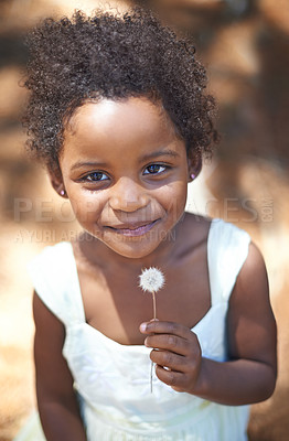 Buy stock photo Happy, black child and portrait in nature, flower and summer holiday with sunshine in forest. Young, african toddler and smile face for dandelion on vacation, spring and countryside in relax wellness