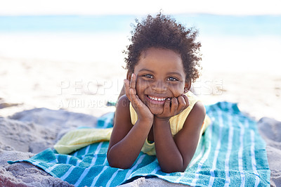 Buy stock photo Smile, african child and portrait on beach sand, towel and summer holiday with sunshine in nature. Black girl, young and happy face to relax on vacation, cape town and ocean for wellness in outdoor