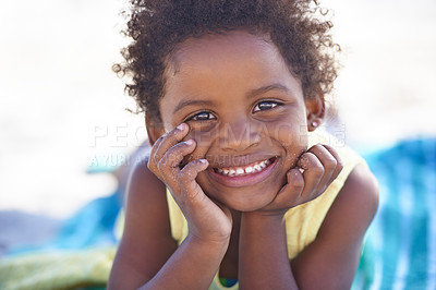 Buy stock photo Happy, african child and portrait on beach sand, relax and summer holiday with sunshine in nature. Black girl, young and smile face on towel on vacation, cape town and seaside for wellness in outdoor