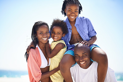 Buy stock photo Black family, parents and kids with portrait on beach for adventure, holiday or vacation in summer. African people, face and smile outdoor in nature for break, experience or bonding with relationship