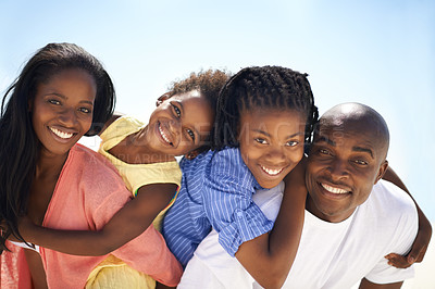 Buy stock photo African family, parents and kids with piggyback on beach for adventure, holiday or vacation in summer. Black people, face or smile outdoor in nature for break, playing or bonding with relationship