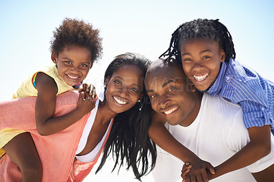 Buy stock photo Black family, parents or children on piggyback at beach for adventure, holiday or vacation in summer. African people, face or smile outdoor in nature for break, experience or bonding and relationship