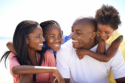 Buy stock photo Happy, love and black family at the beach together for tropical vacation, adventure or holiday. Smile, travel and young African parents with girl children by the ocean for bonding weekend trip.
