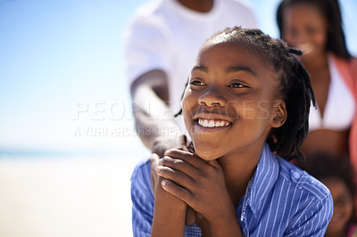 Buy stock photo Thinking, black boy and happiness on beach with family for adventure, holiday or vacation in summer. African kid, face and smile outdoor in nature for break, experience or bonding with relationship