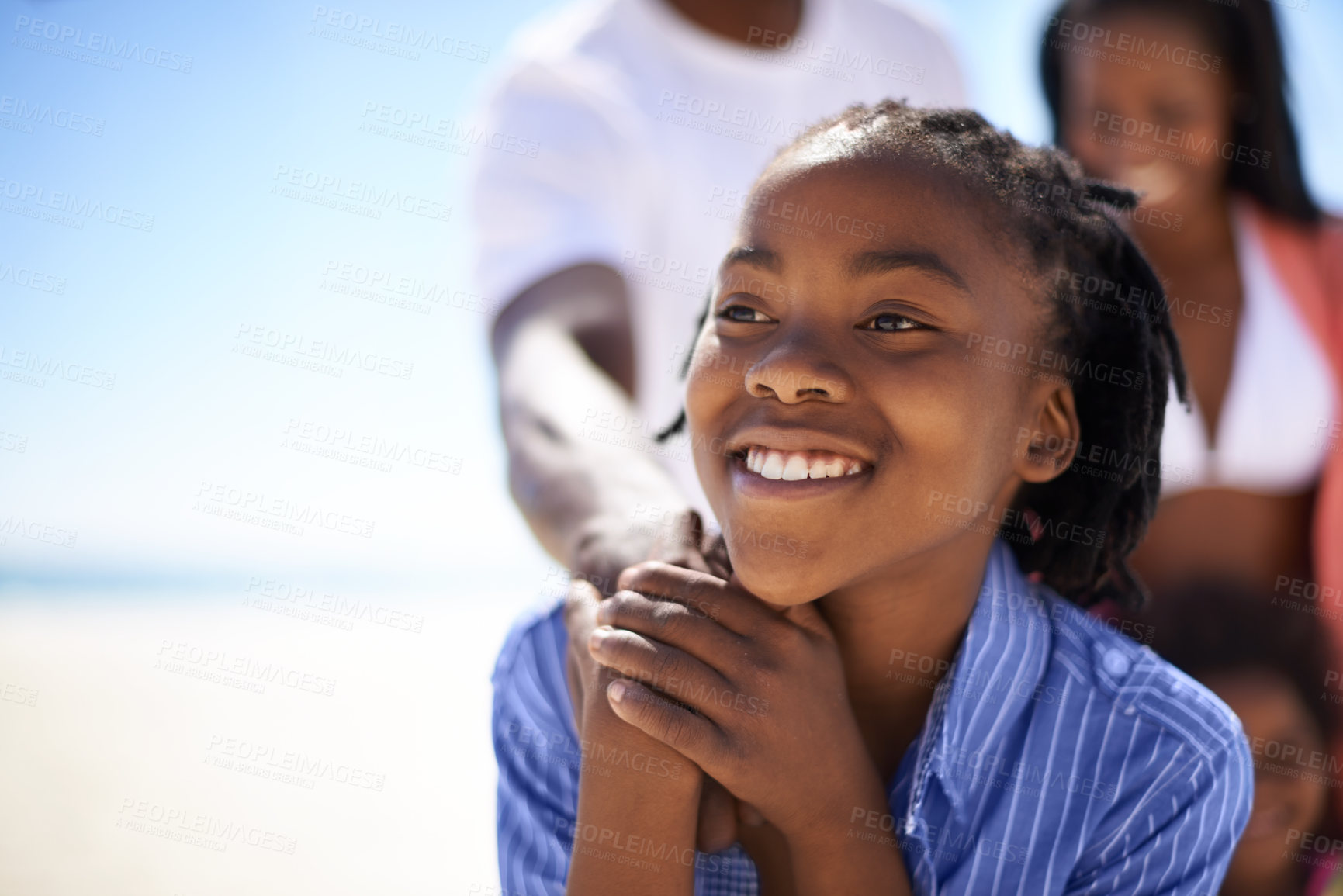 Buy stock photo Thinking, black boy and happiness on beach with family for adventure, holiday or vacation in summer. African kid, face and smile outdoor in nature for break, experience or bonding with relationship