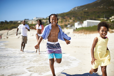 Buy stock photo Black family, parents and children or running at beach for adventure, holiday or vacation in summer. African people, face and smile outdoor in nature for break, experience or bonding and relationship