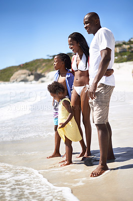 Buy stock photo Black family, parents and children or happy at beach for adventure, holiday or vacation in summer. African people, face or smile outdoor in nature for break, experience or bonding and relationship