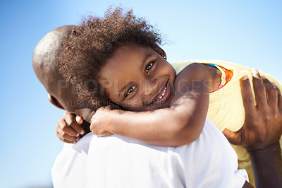 Buy stock photo An african-american father carrying his adorable daughter on his shoulder