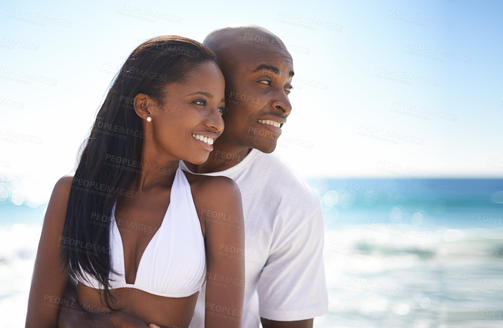Buy stock photo Smile, love and young black couple at the beach for valentines day vacation, holiday or adventure. Happy, romance and African man and woman on a date by the ocean or sea on weekend trip together.