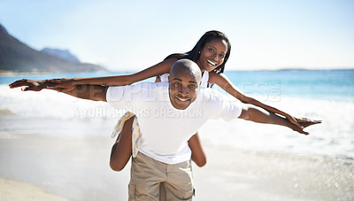 Buy stock photo Black couple, smiling and piggyback with portrait, beach and married for summer vacation. African, enjoying and happy for holiday, fun and seaside in outdoor, beautiful and day off in costal city
