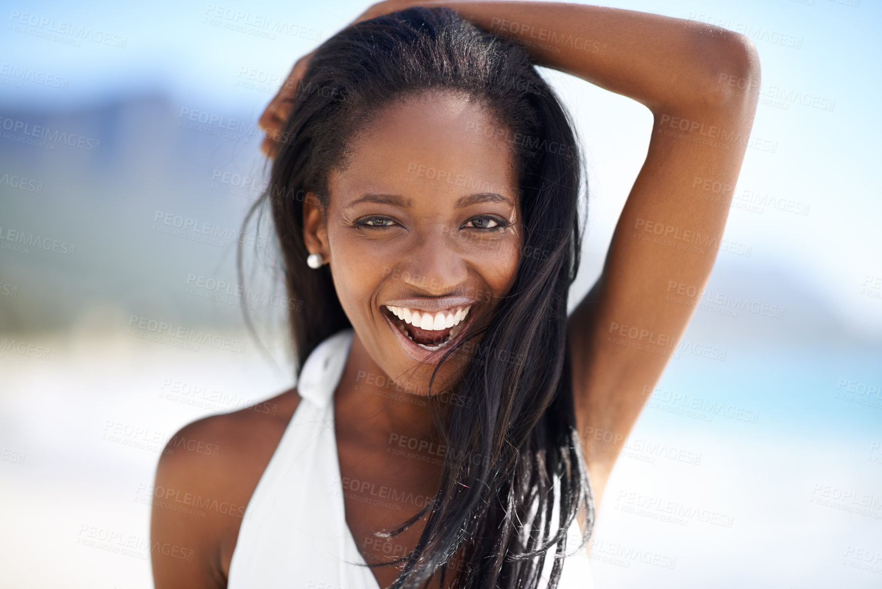 Buy stock photo Portrait of black woman on beach, holiday and smile with blue sky, sunshine and tropical island travel. Sea, mountain and relax, girl on ocean vacation for summer adventure with peace and happiness.