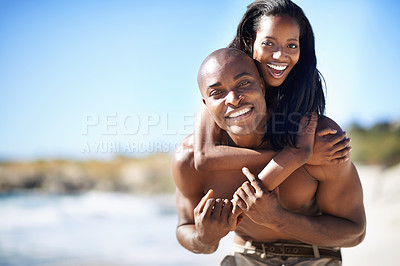 Buy stock photo Happy couple, smile and piggyback with portrait, beach and married for summer vacation. African, enjoying and excited for holiday, fun and seaside in outdoor, beautiful and day off in costal city
