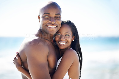 Buy stock photo Smile, hugging and portrait of black couple at the beach for valentines day vacation, holiday or adventure. Happy, embracing and African man and woman on a date by the ocean on weekend trip together.