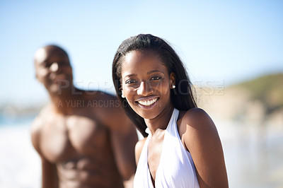 Buy stock photo Portrait of black couple on beach, relax and smile on holiday with swimwear, sunshine and tropical travel. Sea, happy man and woman on ocean vacation in summer with adventure, love and blue sky.