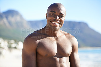 Buy stock photo Portrait of black man on beach, holiday and smile with freedom, sunshine and tropical island travel. Sea, mountain and person on ocean vacation in summer with adventure, peace and blurred background.