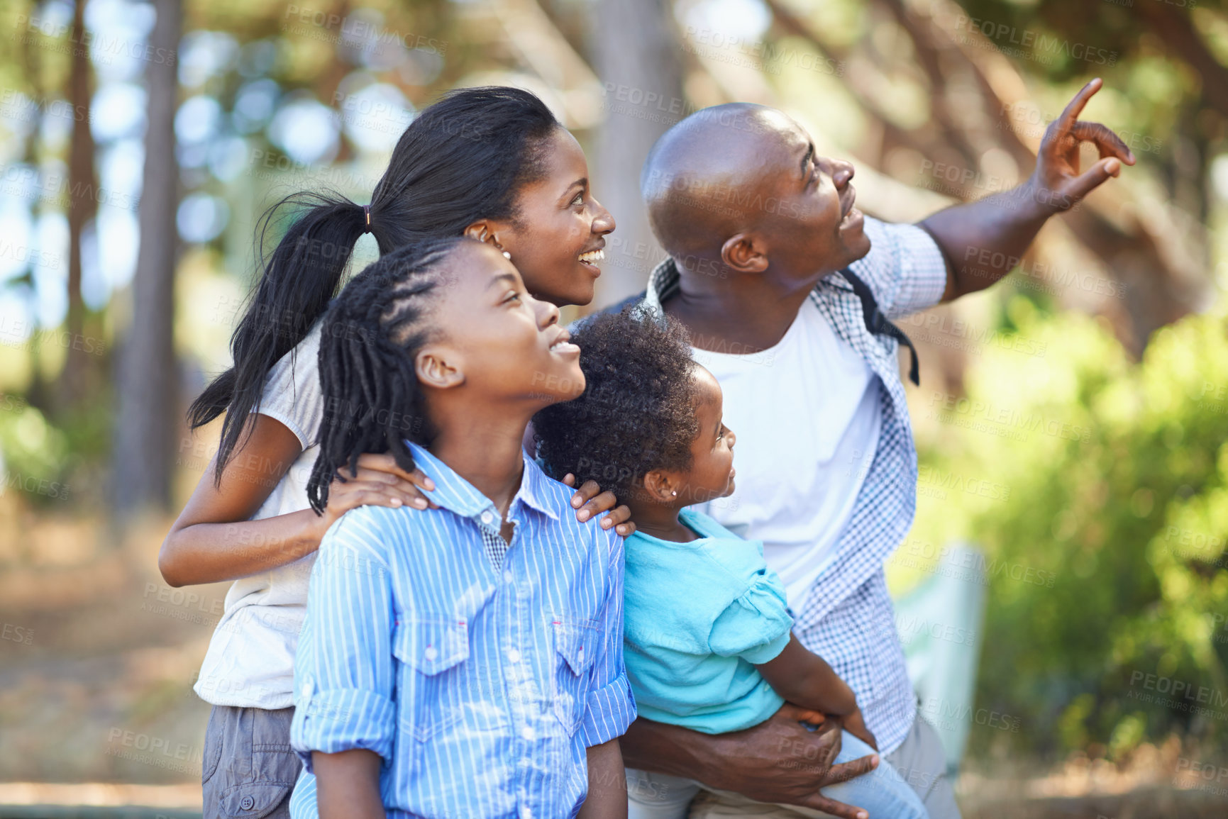 Buy stock photo Smile, hiking and pointing with a black family in the forest together for travel, adventure or discovery. Mother, father and children outdoor in nature, the environment of woods for summer exploring