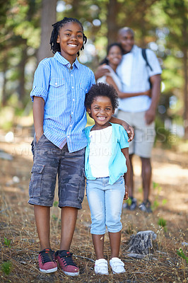 Buy stock photo Smile, portrait or happy kids hiking in forest to relax or bond on holiday vacation together in nature. Children siblings, black family or African parents in woods trekking on outdoor adventure 