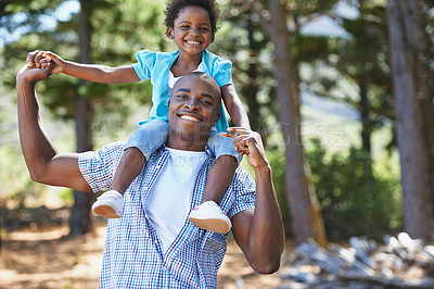 Buy stock photo Kid, happy father in portrait and piggyback outdoor, care or bonding together. Face, African dad carry child and smile in nature, family play in forest park for hiking adventure and holding hands