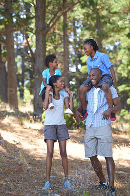 Buy stock photo Happy, travel or black family hiking in forest to relax or bond on holiday vacation together in nature. Children siblings, mother or African father in woods trekking on outdoor adventure with smile