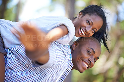 Buy stock photo Piggyback, portrait or happy black couple in park to relax or bond on holiday vacation together to travel. Romantic, playing or African woman with smile, care or man in woods on fun outdoor adventure