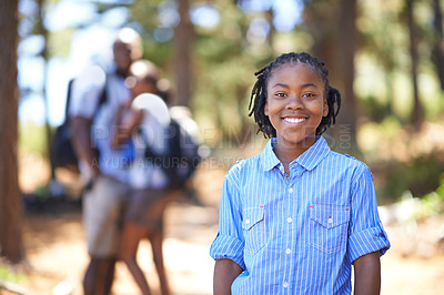Buy stock photo Portrait, smile and a kid hiking in the forest together with his parents for travel, freedom or adventure. Black family, nature or environment with a young boy child, mother and father in the woods