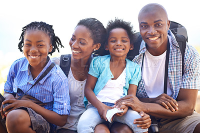 Buy stock photo Portrait of a happy-looking family taking a break while out on a hike together