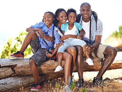 Buy stock photo Happy, portrait or black family in forest to relax or bond on log or holiday vacation together in nature. Children siblings, mother or African father hiking in woods on outdoor adventure with smile