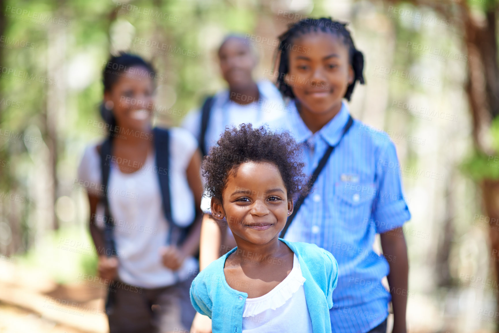 Buy stock photo Parents, portrait or girl hiking in forest to relax or bond on holiday vacation together in nature. Children siblings, family or happy African kid in woods trekking on outdoor or park adventure