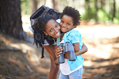 Buy stock photo Portrait, binocular or black family hiking in forest to relax, hug or bond on holiday vacation together in nature. Child, happy or mom in woods or park to travel on fun outdoor adventure with smile