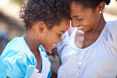 Buy stock photo Daughter, love or mother in nature or forest to relax, care or bond on a summer holiday vacation. Kid, forehead or happy African mom in park or woods on outdoor adventure with support or black family