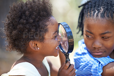 Buy stock photo Kids, nature and magnifying glass in a forest for face, inspection or discovery in search together. Black family, children and magnifier in park for adventure, learning or exploring, games or fun